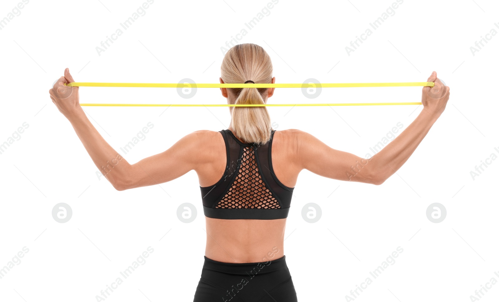 Photo of Woman exercising with elastic resistance band on white background, back view