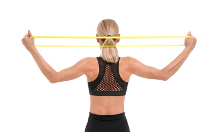 Photo of Woman exercising with elastic resistance band on white background, back view