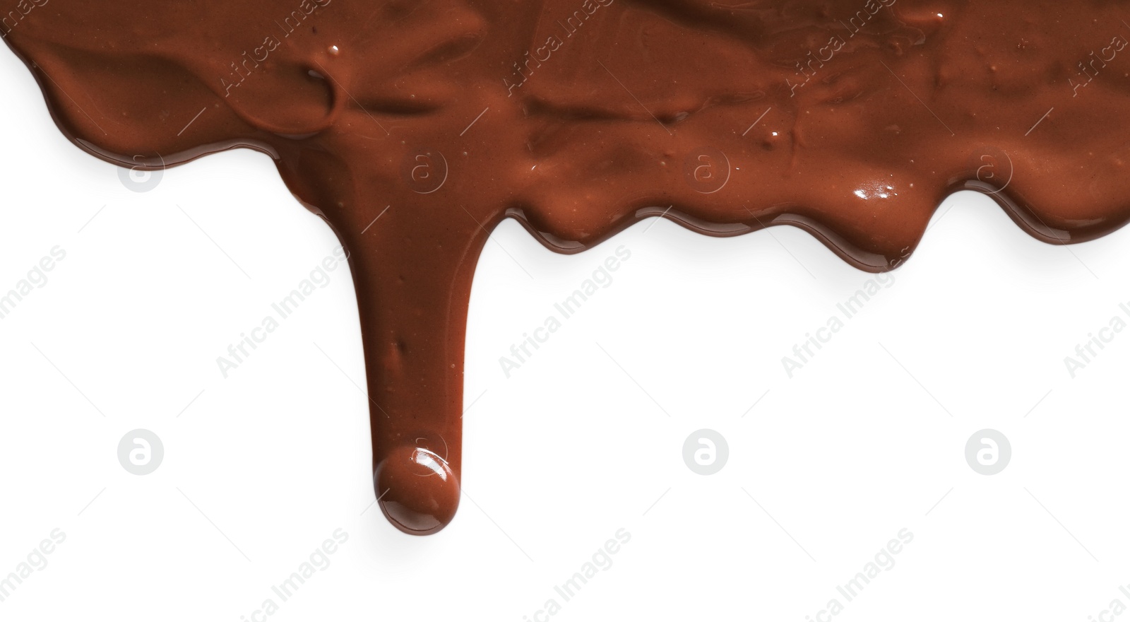 Photo of Tasty melted milk chocolate pouring down on white background