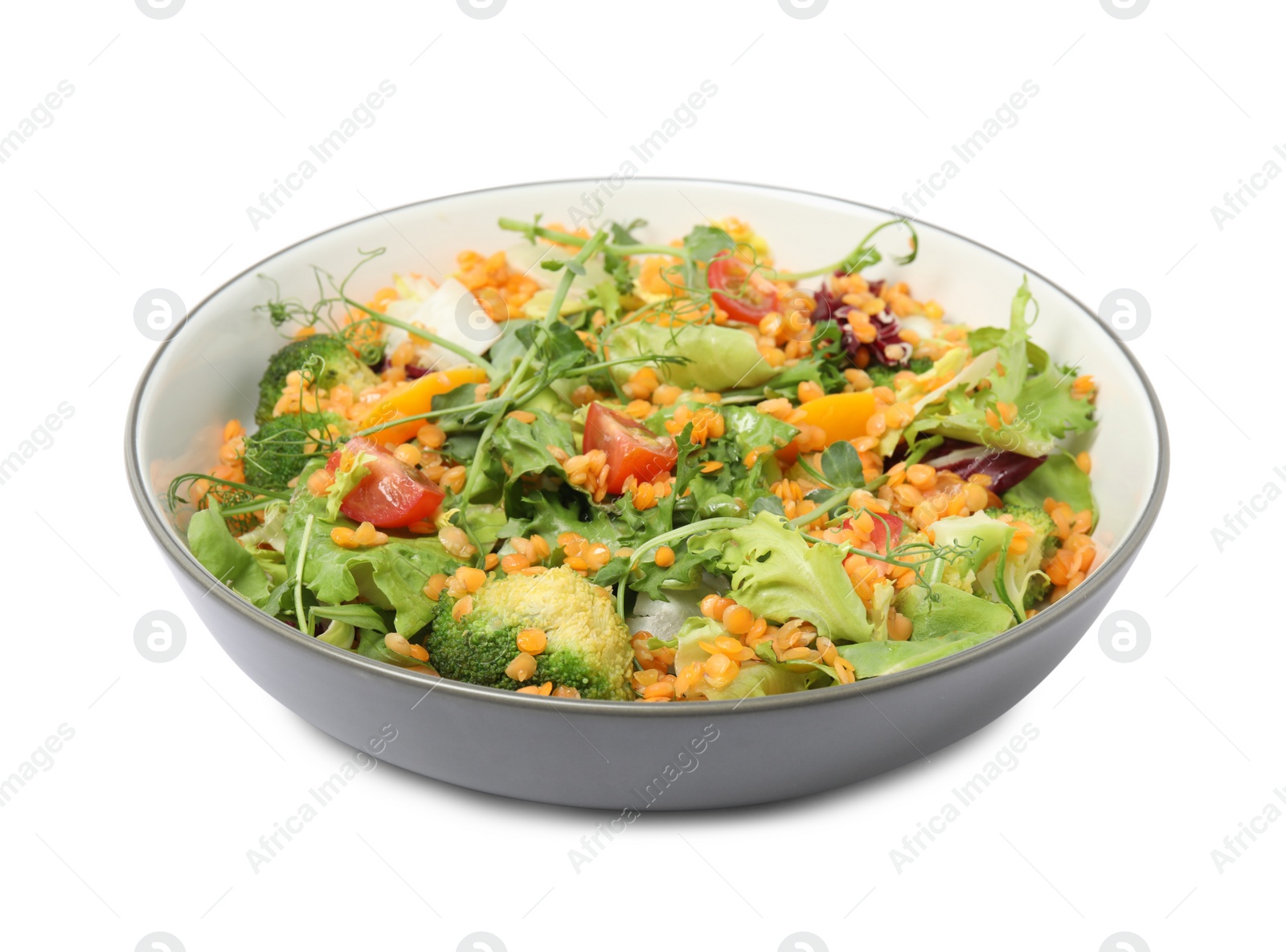 Photo of Bowl of delicious salad with lentils and vegetables isolated on white