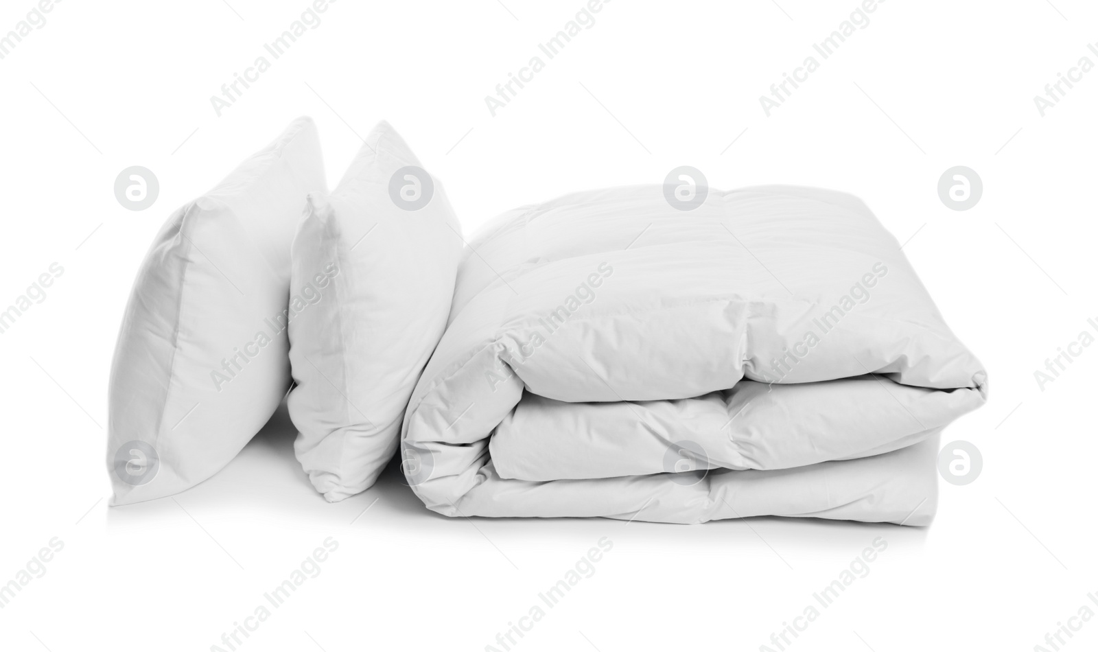 Photo of Clean blanket and pillows on white background