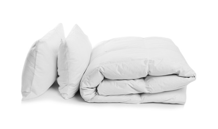 Photo of Clean blanket and pillows on white background