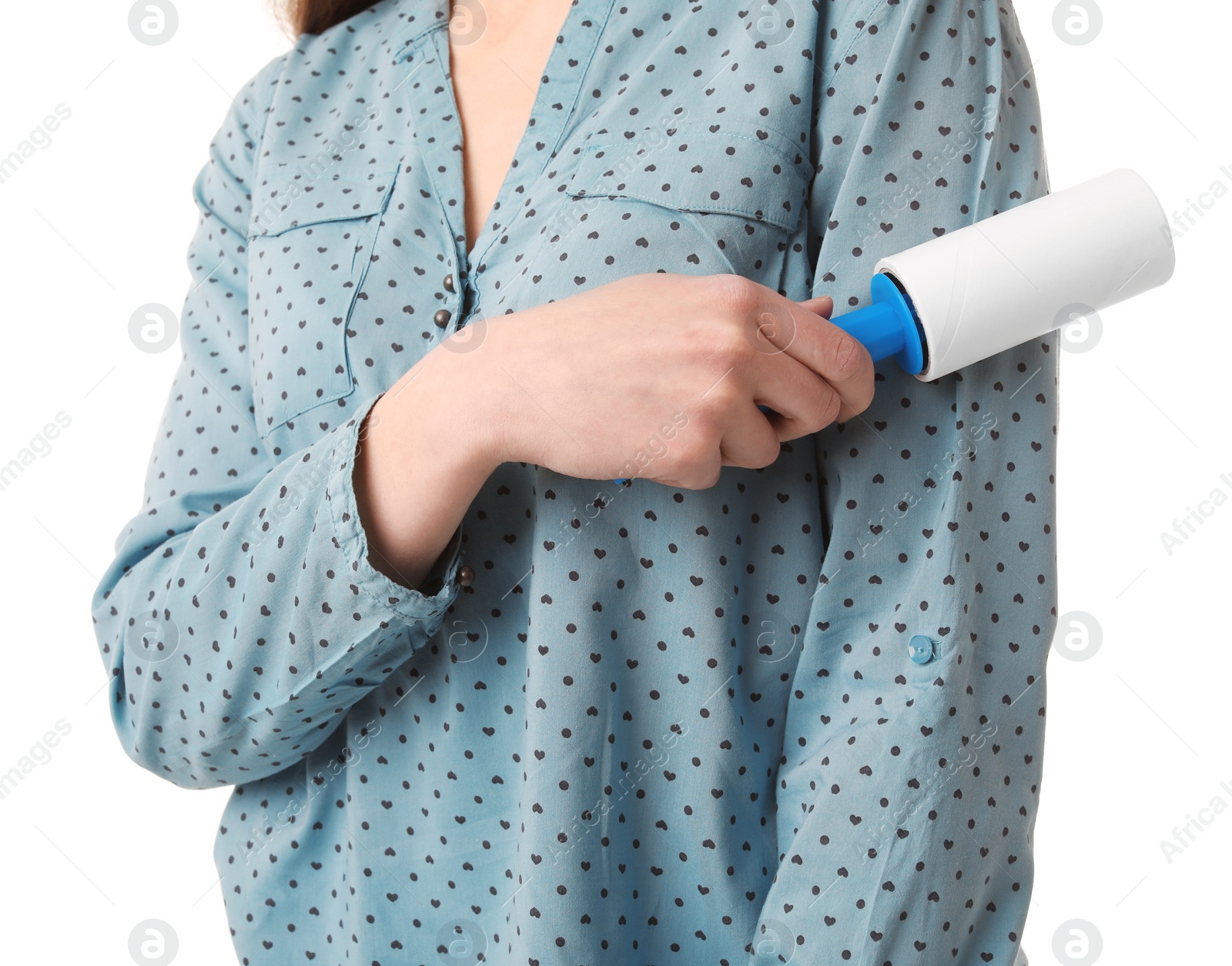 Photo of Young woman cleaning blouse with lint roller on white background