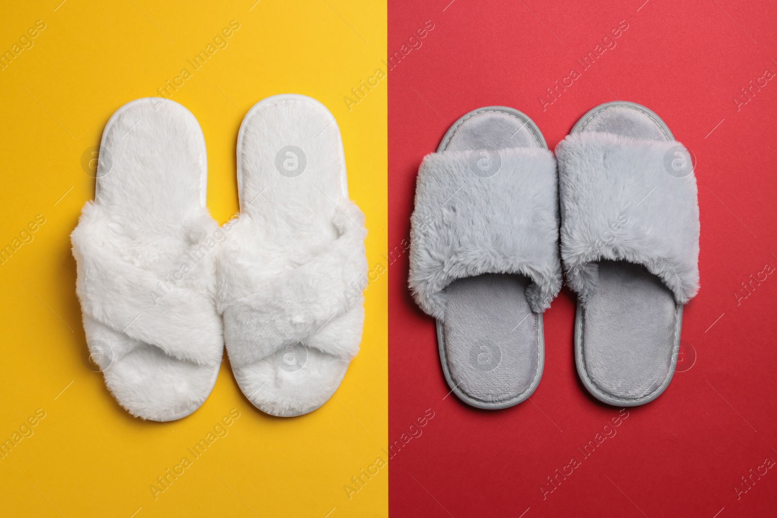 Photo of Different soft fluffy slippers on color background, flat lay