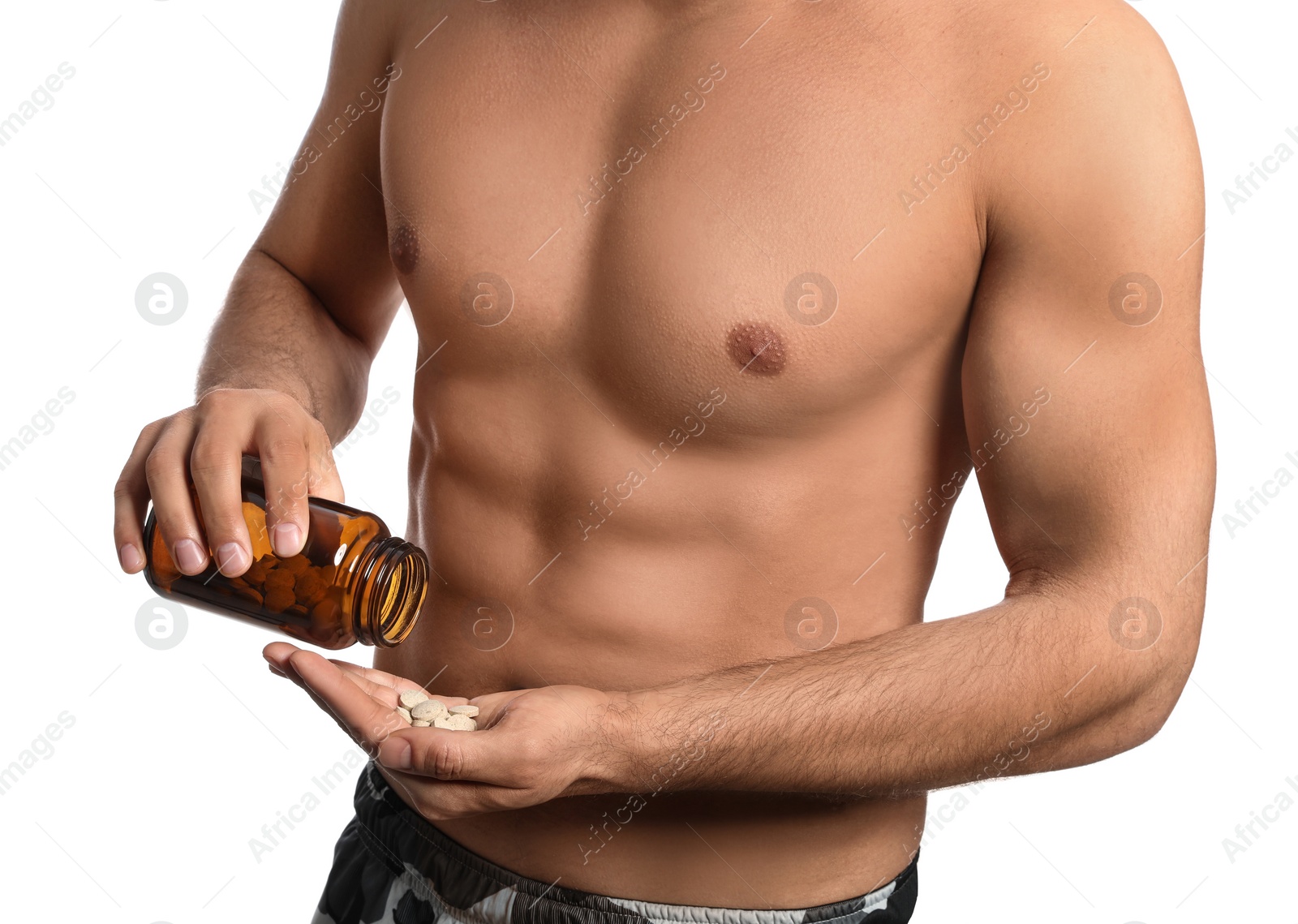 Photo of Athletic man with bottle of pills on white background, closeup. Doping concept