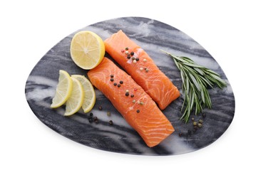 Photo of Pieces of fresh raw salmon, spices and lemon slices isolated on white, top view