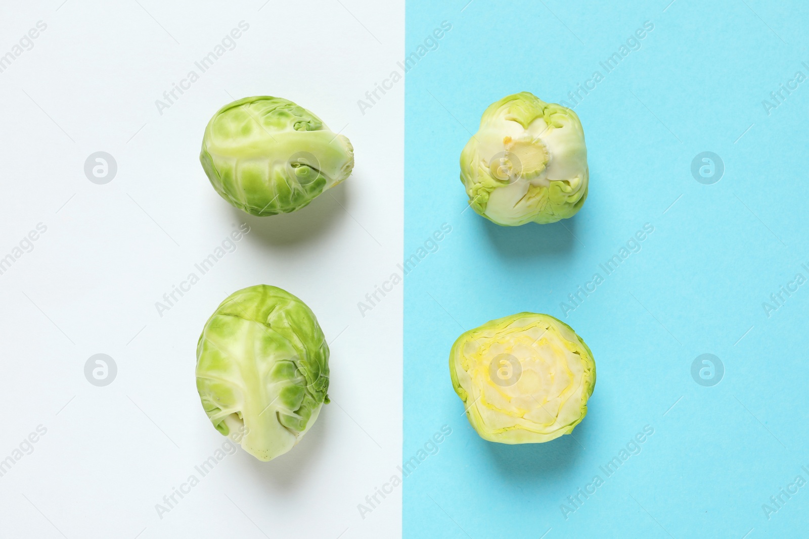 Photo of Fresh Brussels sprouts on color background, flat lay