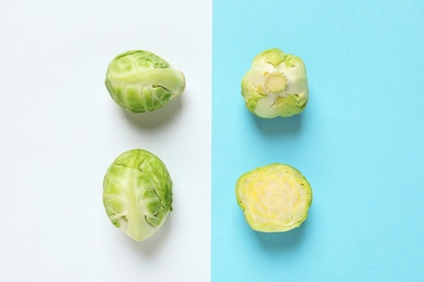 Photo of Fresh Brussels sprouts on color background, flat lay