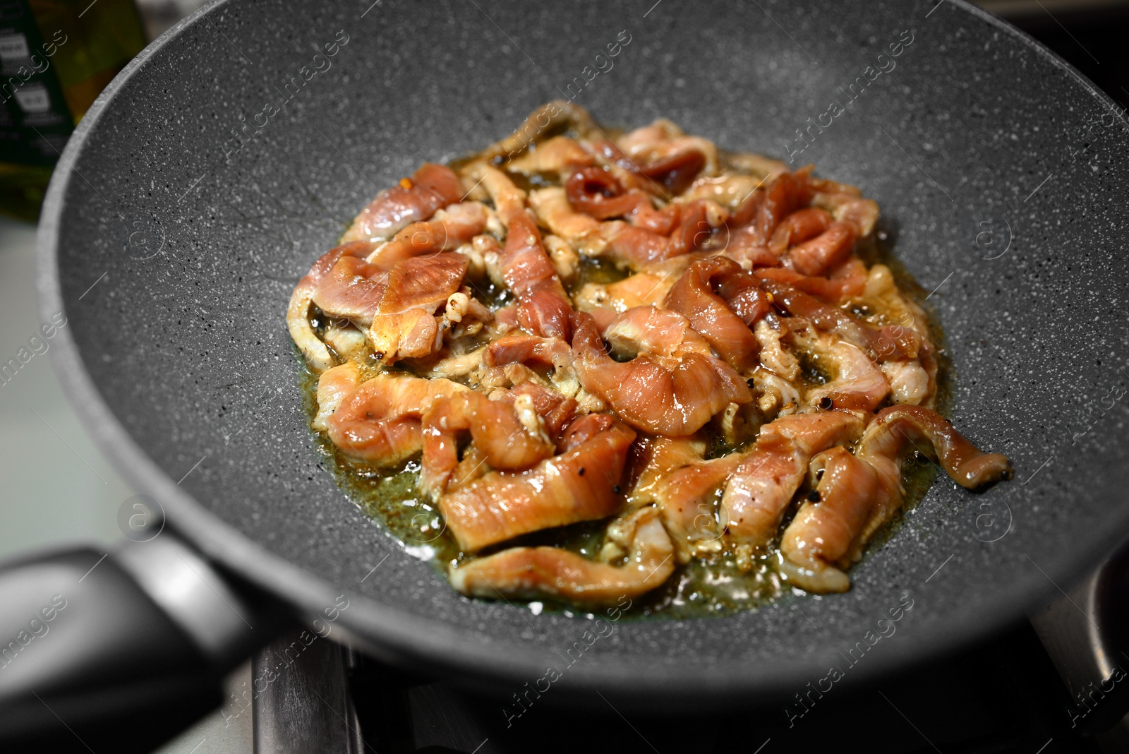 Photo of Cooking delicious meat on frying pan with oil, closeup