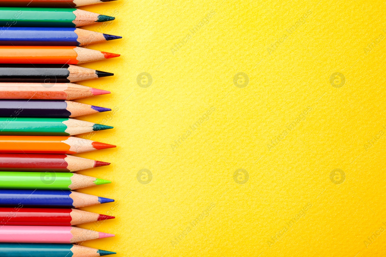 Photo of Collection of pencils on table, top view. Color palette