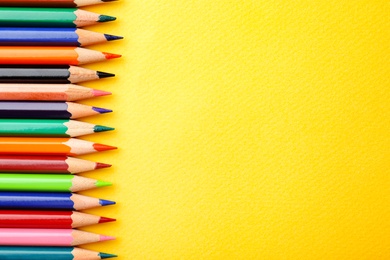 Photo of Collection of pencils on table, top view. Color palette