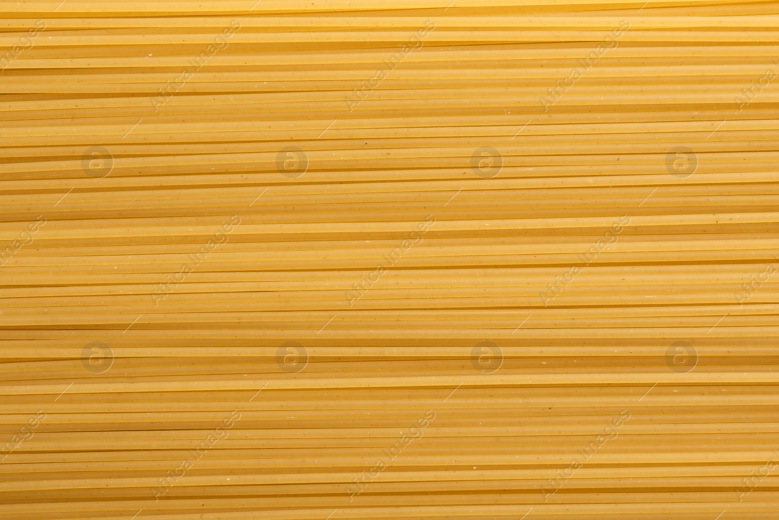 Photo of Uncooked pasta as background, closeup