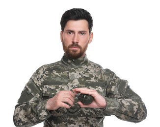Photo of Soldier pulling safety pin out of hand grenade on white background. Military service