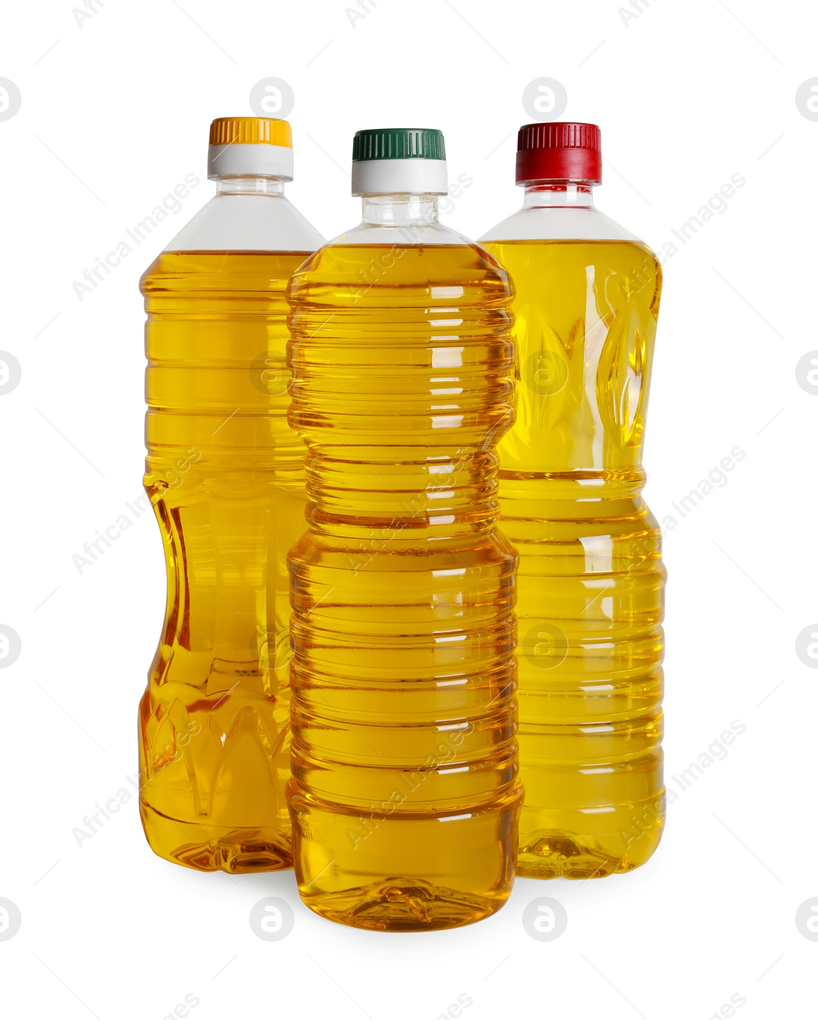 Photo of Bottles of cooking oil on white background