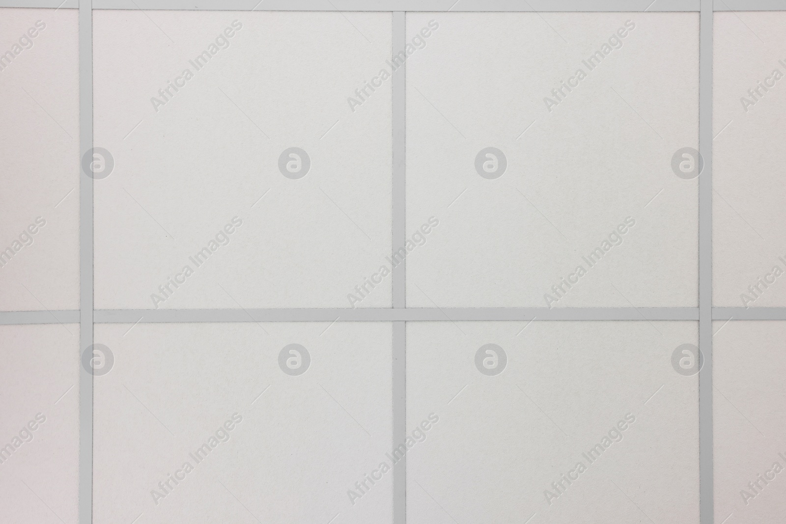 Photo of White ceiling with PVC tiles, view from below