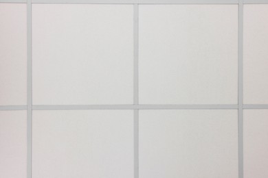 Photo of White ceiling with PVC tiles, view from below