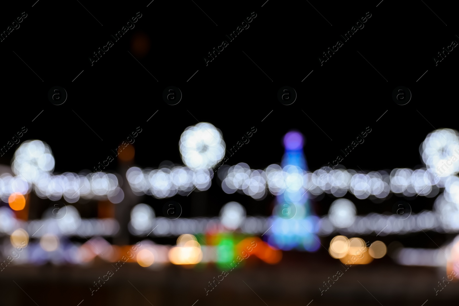 Photo of Beautiful street lights at night. Bokeh effect