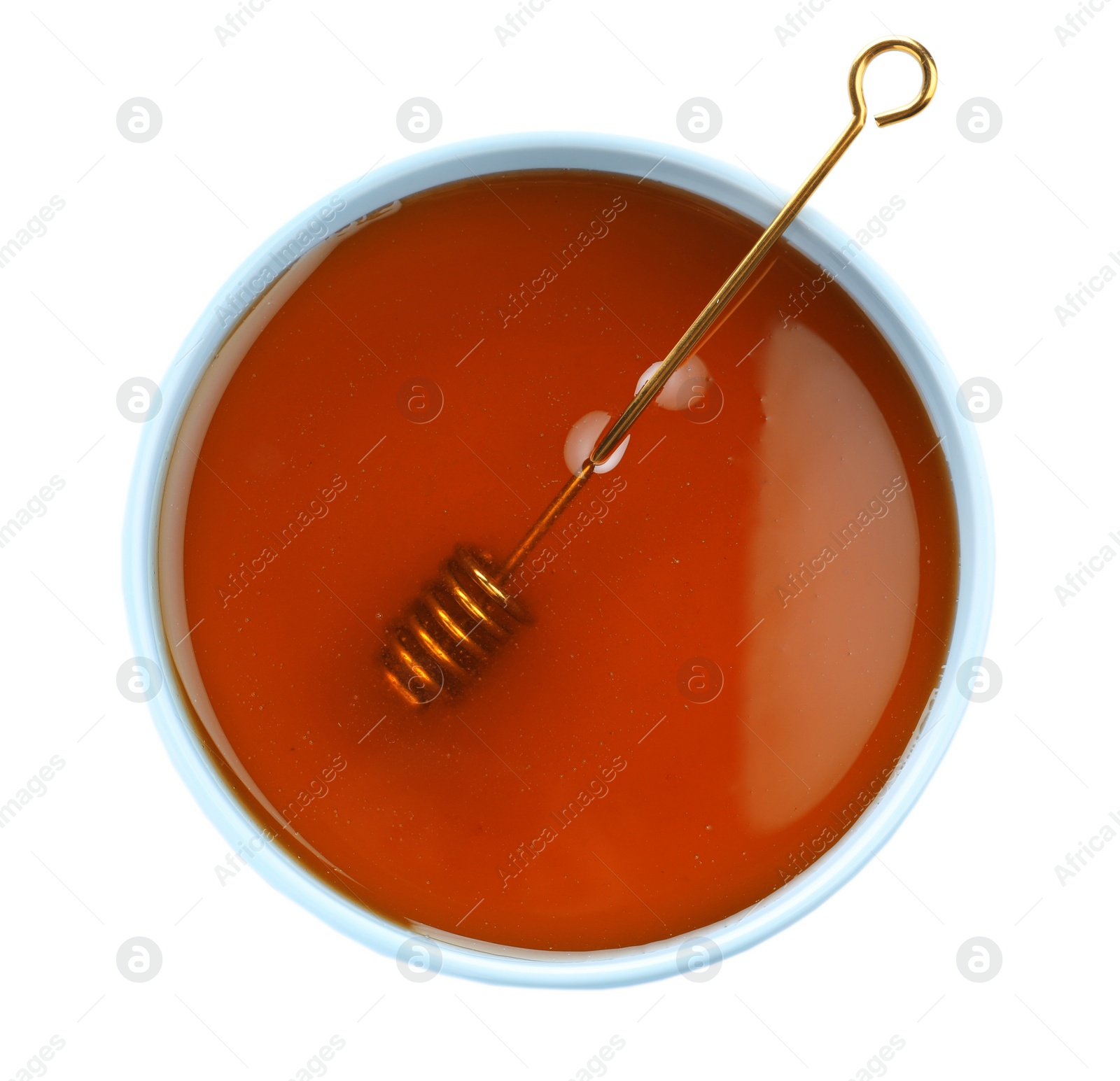 Photo of Bowl of organic honey and dipper isolated on white, top view