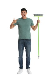 Photo of Man with green broom on white background