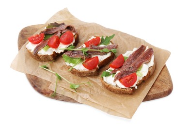 Photo of Delicious bruschettas with anchovies, tomatoes, microgreens and cream cheese on white background