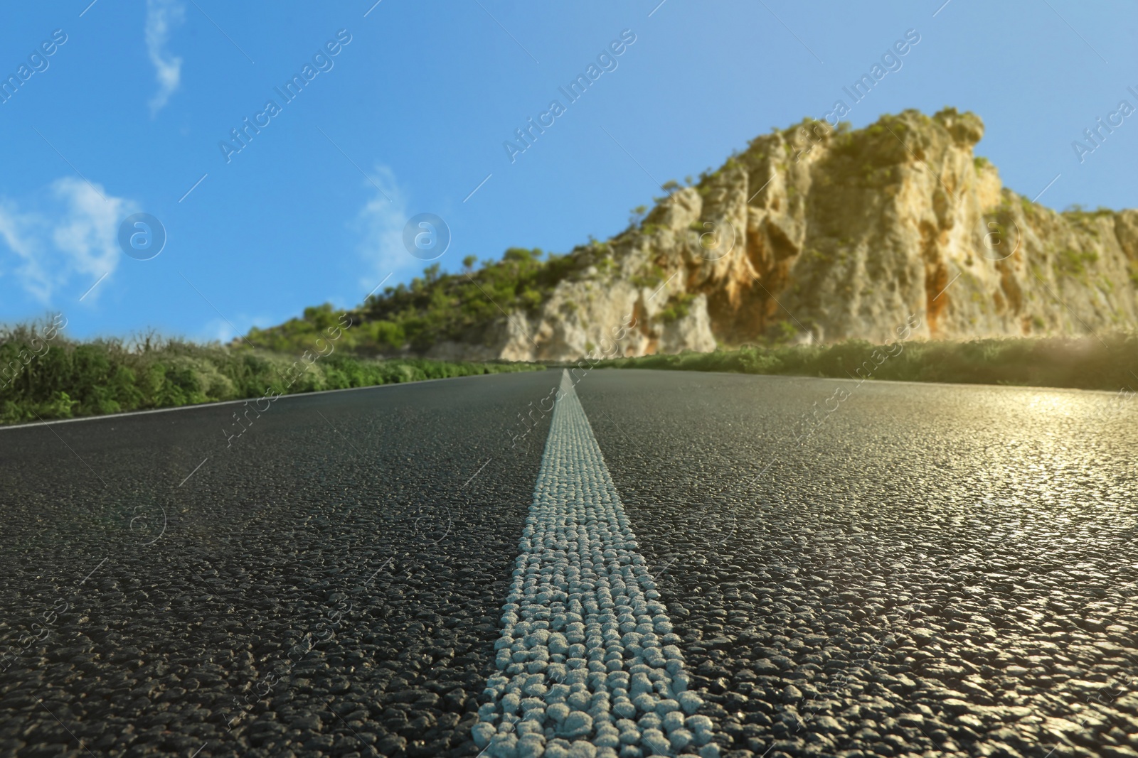 Image of Empty asphalt road in mountains, low angle view