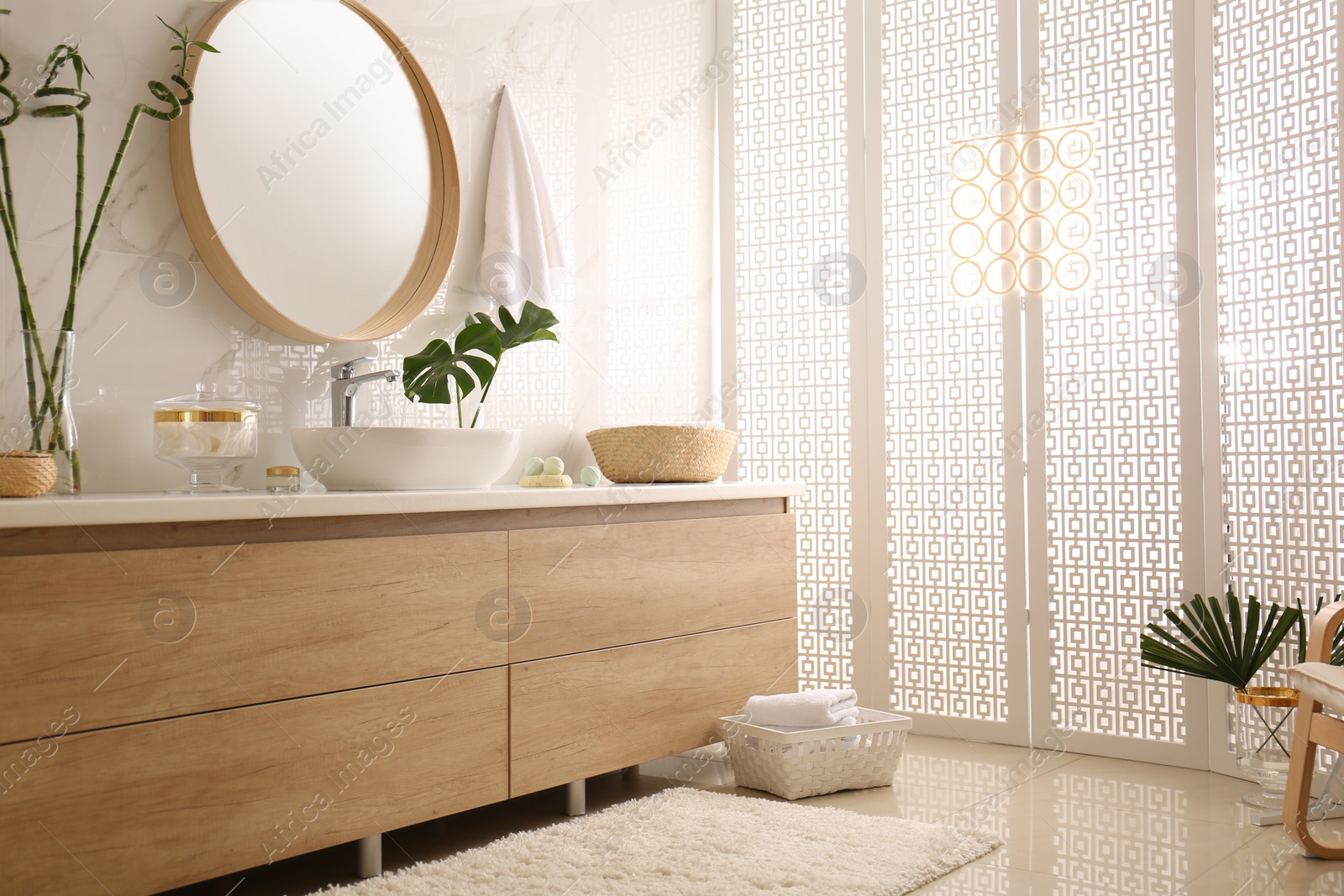 Photo of Modern bathroom interior with stylish white folding screen