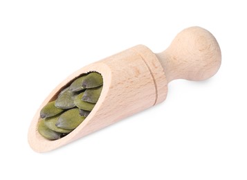 Wooden scoop with pumpkin seeds isolated on white