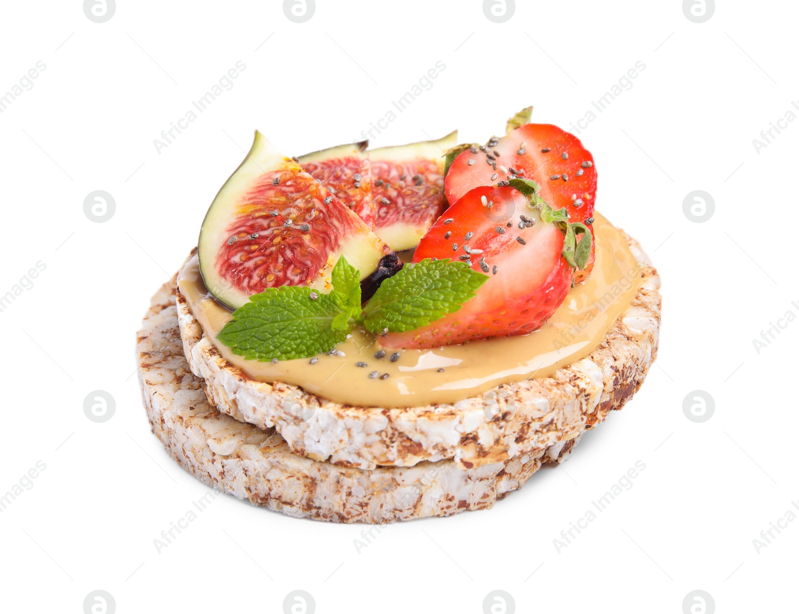 Photo of Tasty crispbreads with peanut butter, figs, mint and strawberry on white background