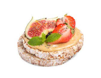 Photo of Tasty crispbreads with peanut butter, figs, mint and strawberry on white background