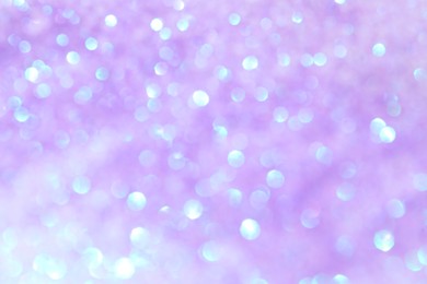 Shiny lilac background with magical bokeh effect