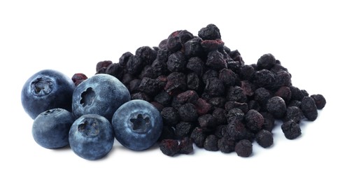 Photo of Sweet sublimated and fresh blueberries on white background