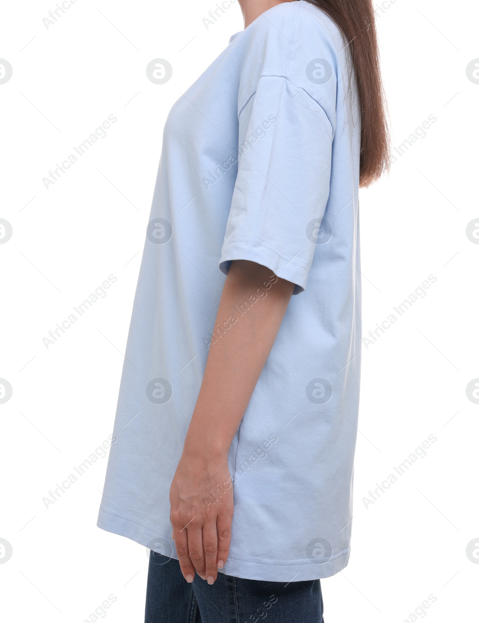 Photo of Woman in stylish light blue t-shirt on white background, closeup
