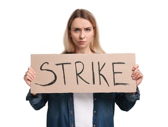 Upset woman holding cardboard banner with word Strike on white background