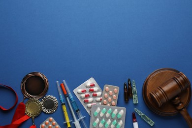 Flat lay composition with drugs on blue background, space for text. Doping control