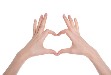 Photo of Woman making heart with her hands on white background, closeup