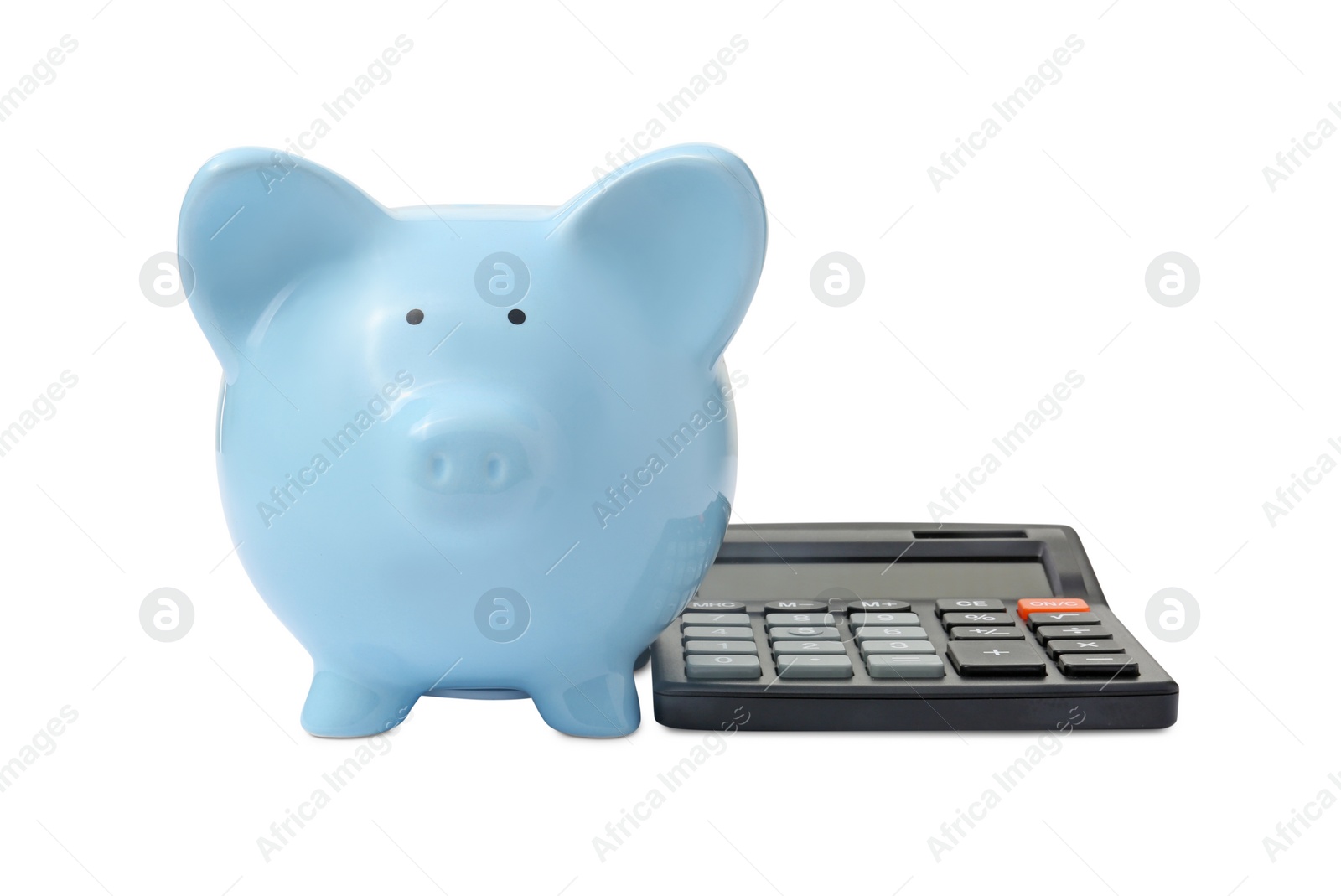 Photo of Calculator and piggy bank isolated on white