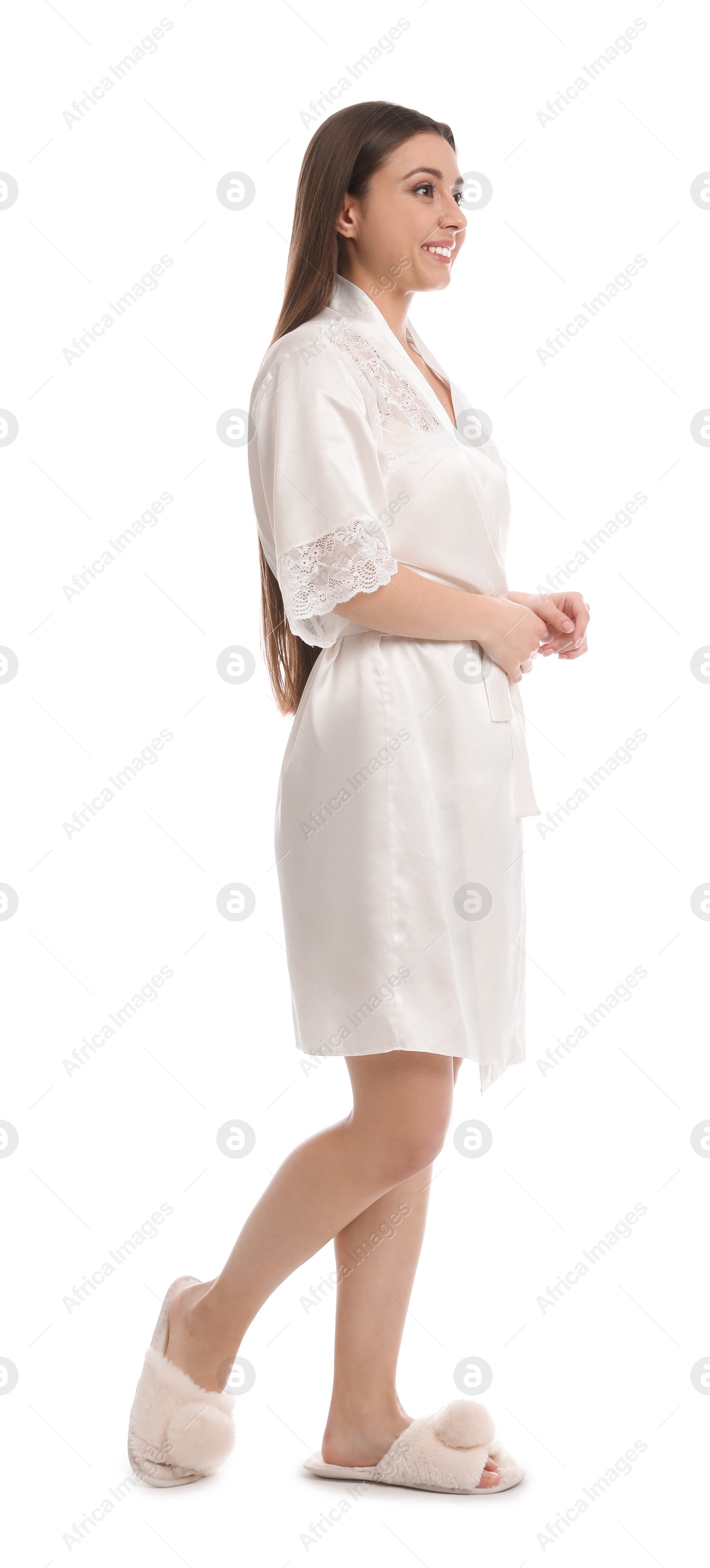 Photo of Young woman in silk robe on white background