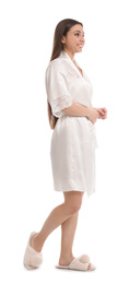 Photo of Young woman in silk robe on white background