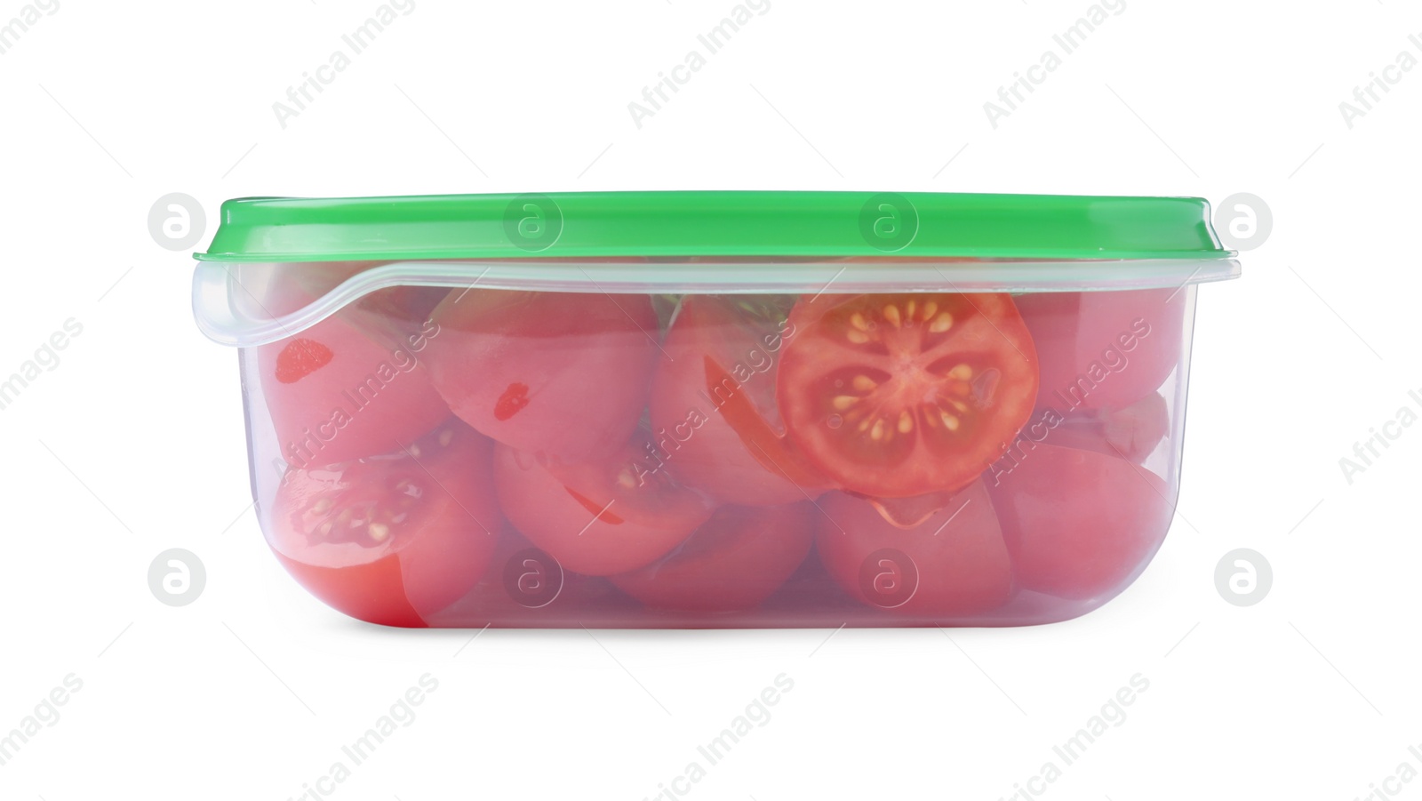 Photo of Fresh cut cherry tomatoes in plastic container isolated on white