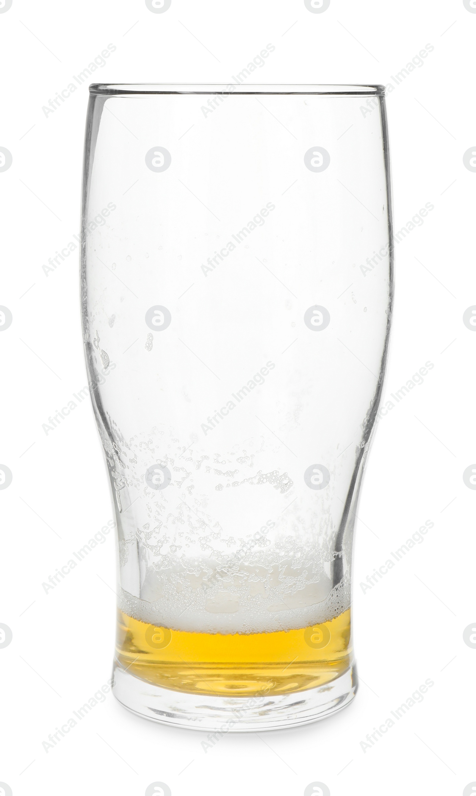 Photo of Almost empty glass of beer isolated on white