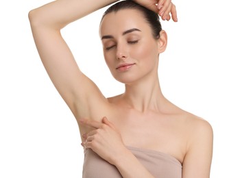 Beautiful woman showing armpit with smooth clean skin on white background