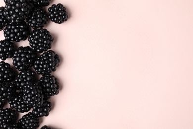 Photo of Tasty ripe blackberries on light background, flat lay. Space for text