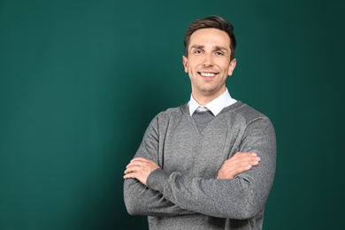 Portrait of male teacher on color background. Space for text