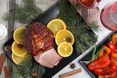 Photo of Festive flat lay composition with delicious ham on grey table. Christmas dinner