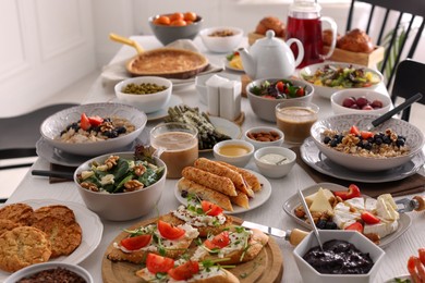 Many different dishes served on buffet table for brunch