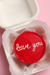 Photo of Tasty bento cake in takeaway box on pink table, top view