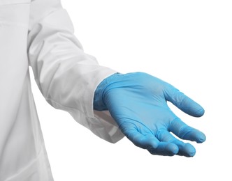 Doctor wearing light blue medical glove holding something on white background, closeup