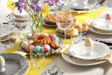 Photo of Festive Easter table setting with traditional meal