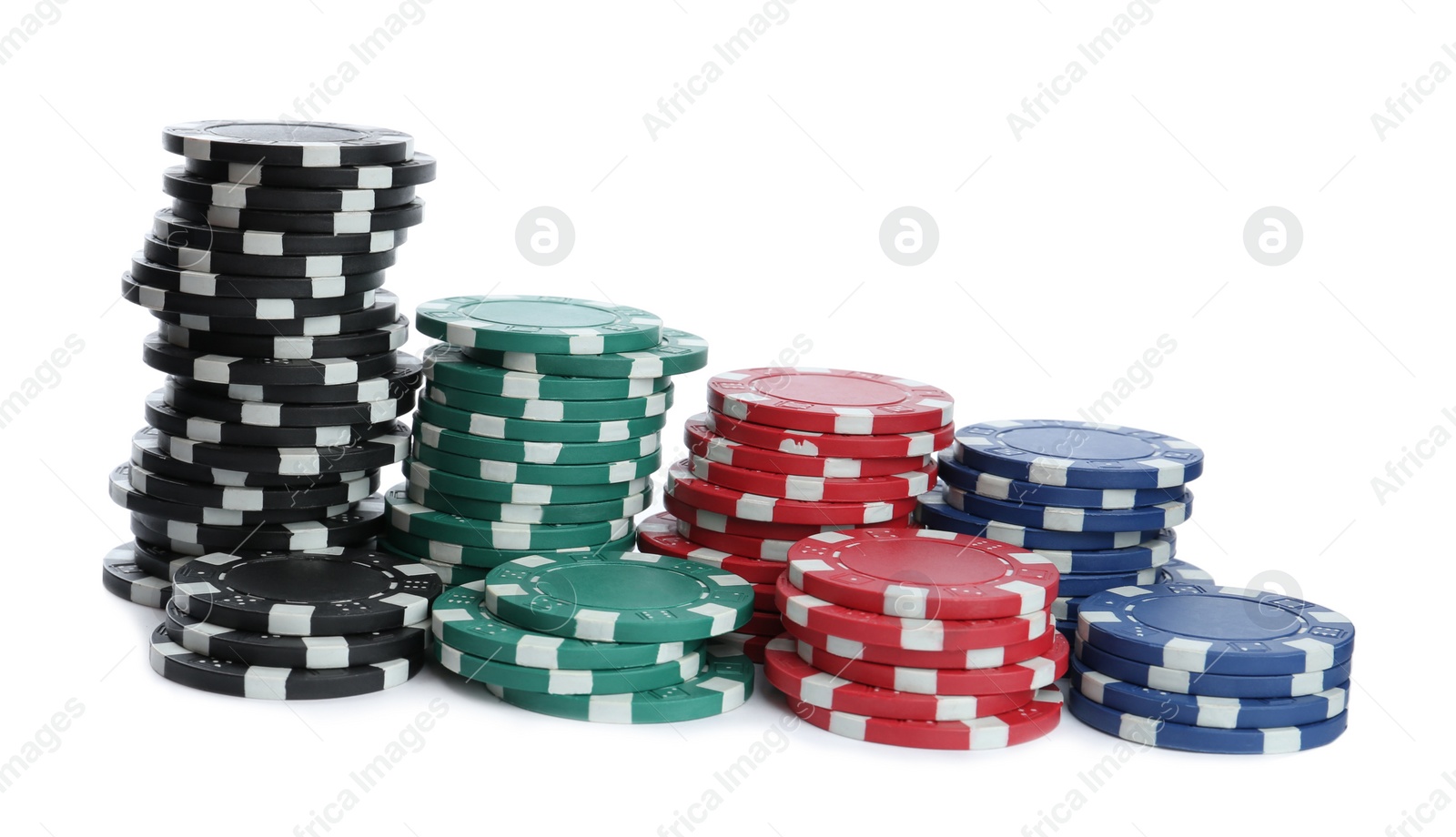 Photo of Plastic casino chips stacked on white background. Poker game