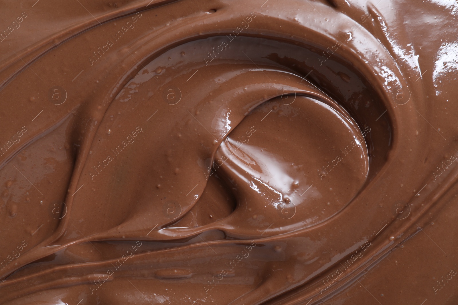 Photo of Tasty chocolate paste as background, closeup view